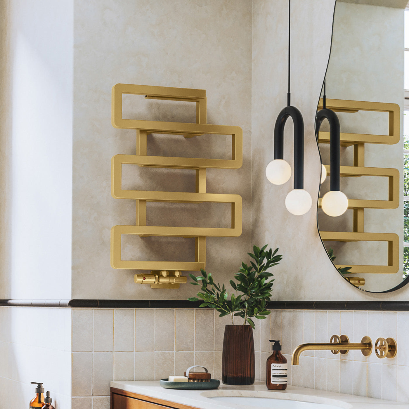 01_Terma-BOOKIE_-655h-x-500w_mm_-1278-BTUs-Heated-Towel-Rail_-Brass