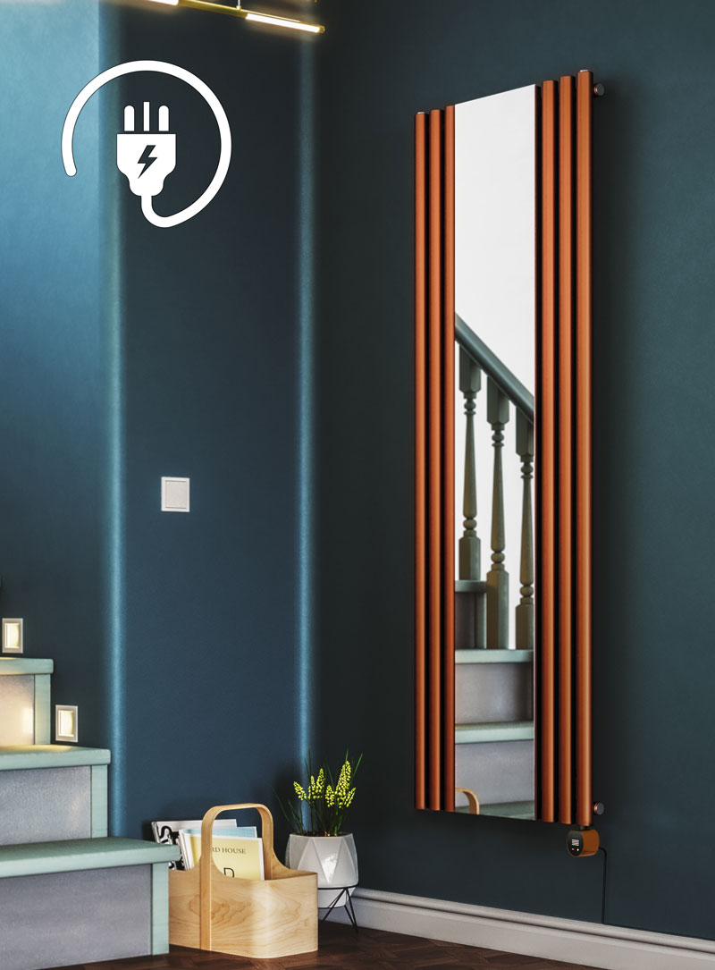 copper electric mirror radiator on a blue wall in a hallway next to the staircase with wooden floor