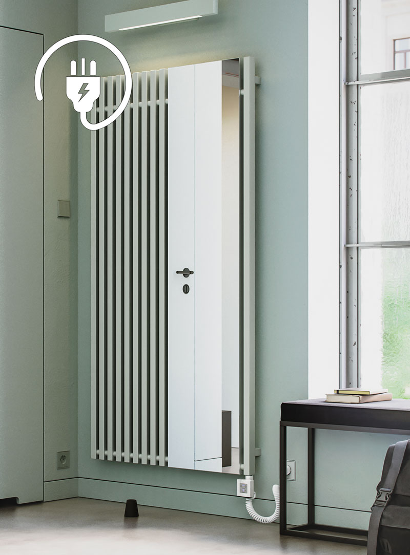 spearmint white electric mirror radiator n an open plan loft style interior with floor to ceiling windows and a concrete floor