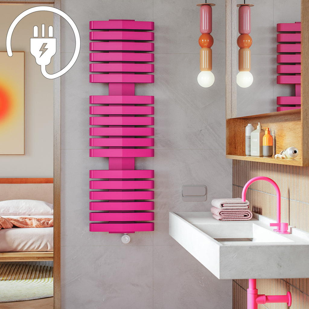 iron d e pink electric towel rail in a girls en suite bathroom